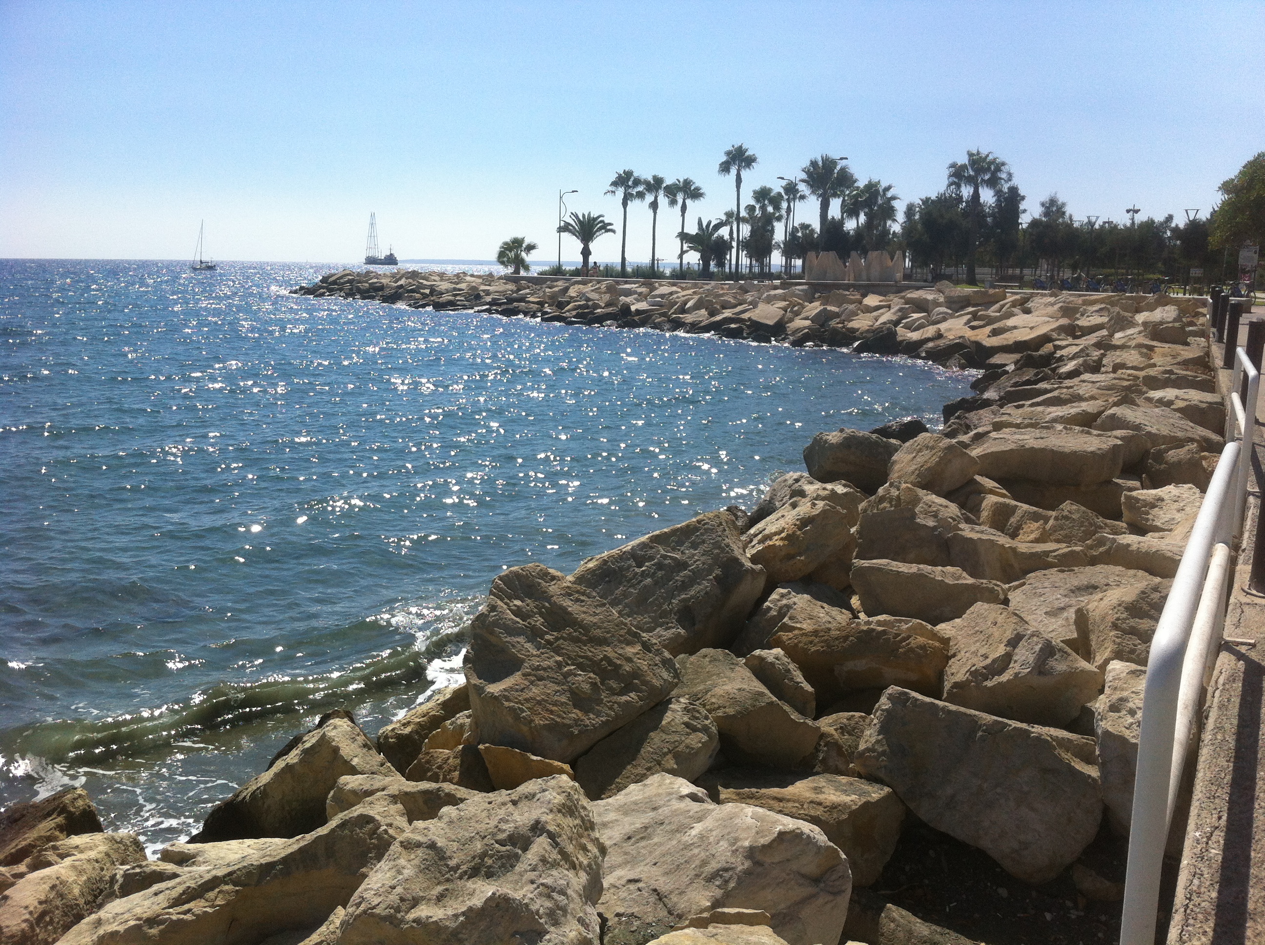 Sunlit coastal promenade and sea in Cyprus