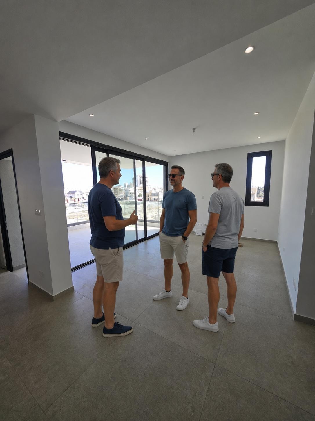 Group discussing a property inside a Cyprus apartment